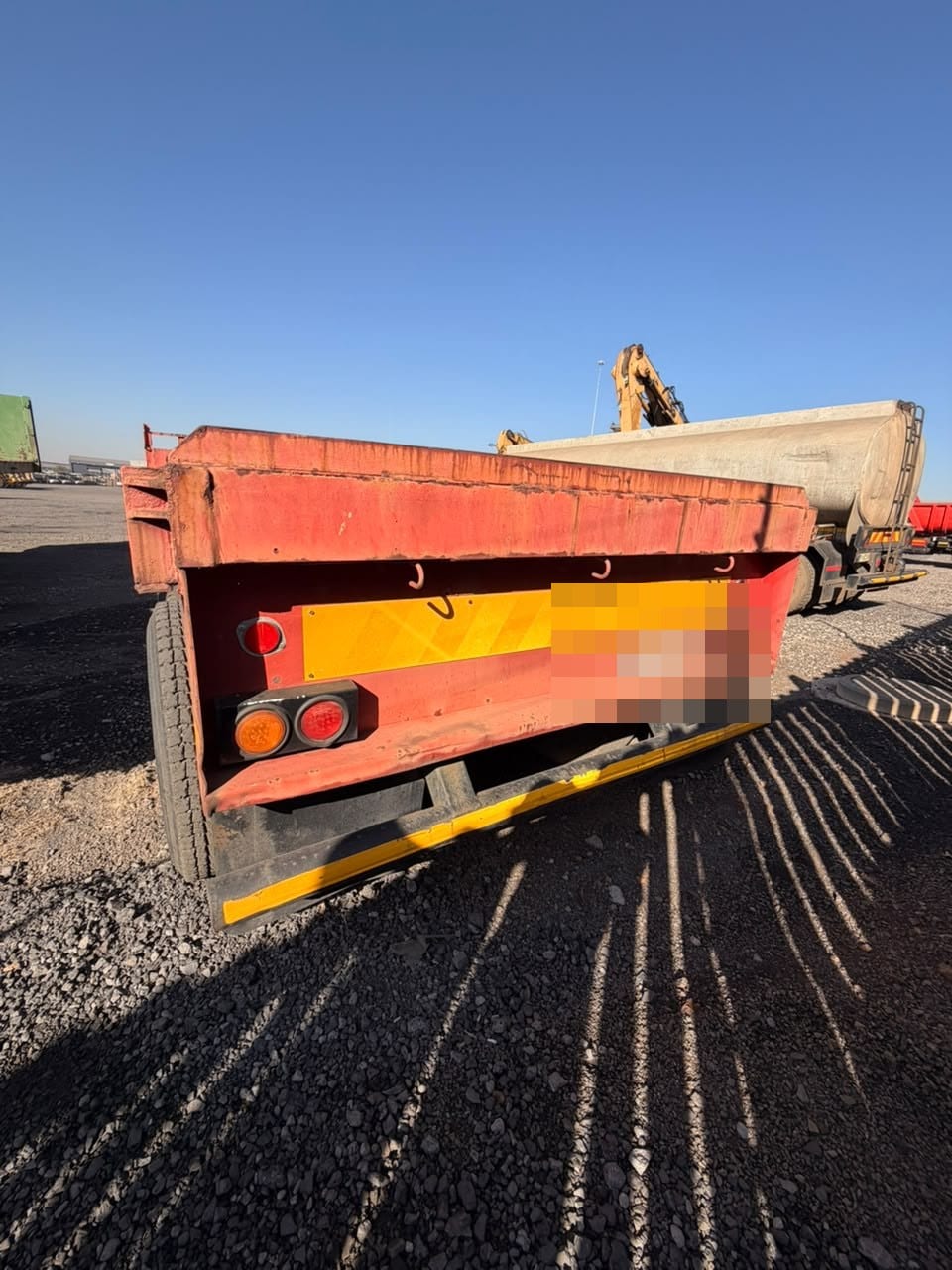 Used 12m flat deck trailer, rear view of the deck, tail lights and chevron plate