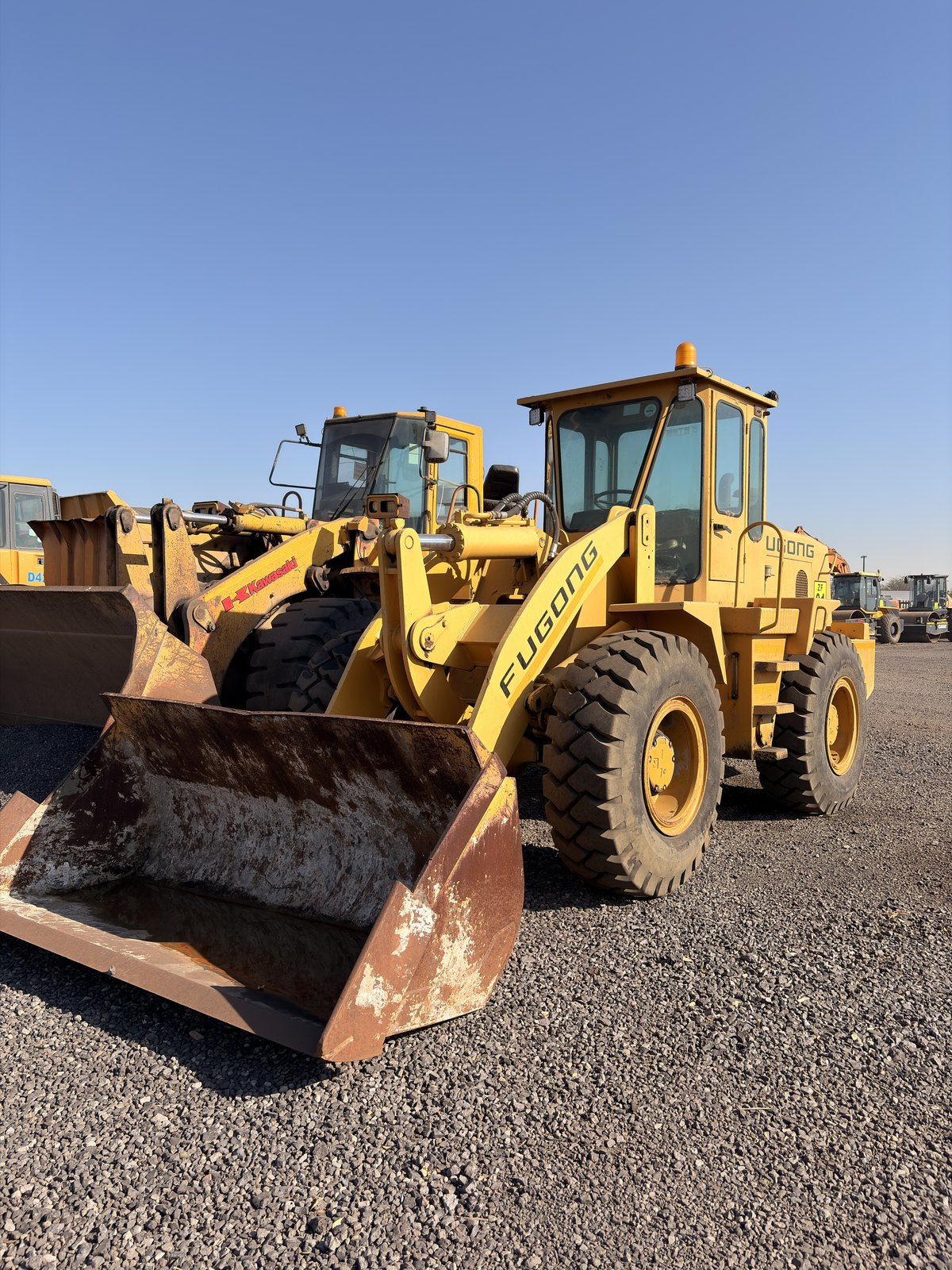 Used Fugong front end loader, front three-quarter view with the bucket down