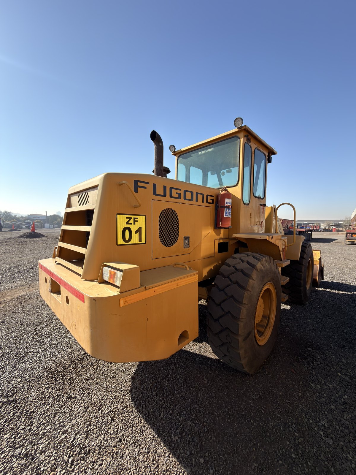 Used Fugong front end loader, rear three-quarter view of the engine hood