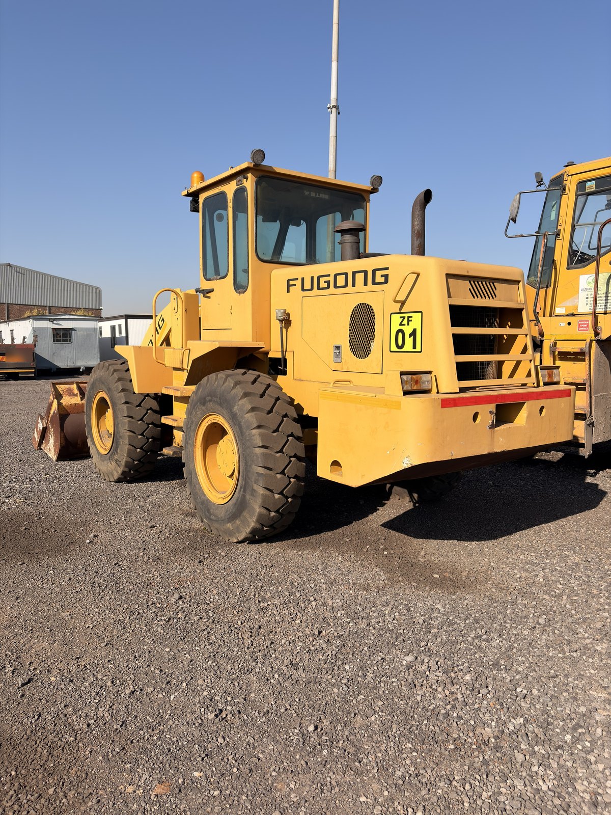 Used Fugong front end loader, side view of the whole machine in the yard