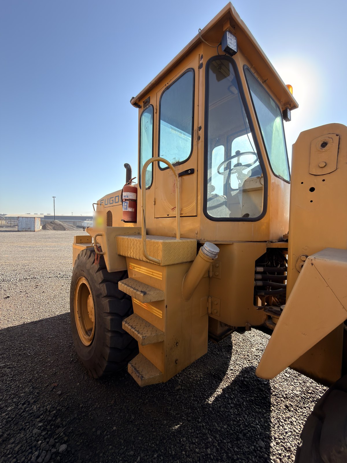 Used Fugong front end loader, front three-quarter view of the cab and steps