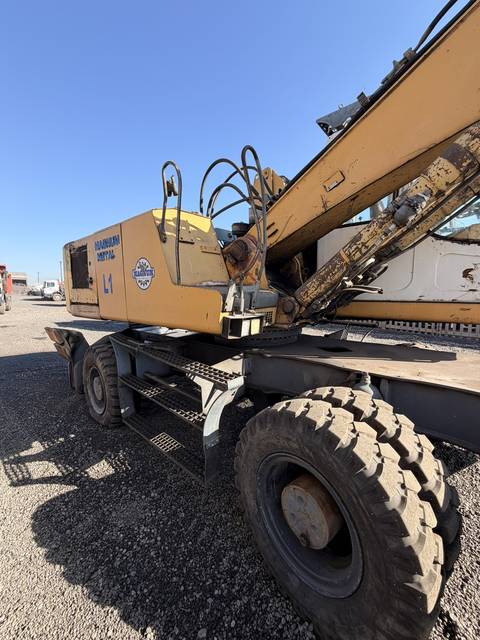 Used Liebherr 924 material handler, side view of the upper structure and steps