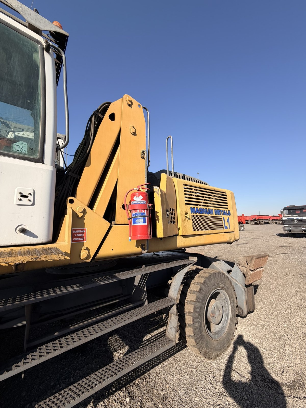 Used Liebherr 924 material handler, side view of the cab, walkway and engine cover