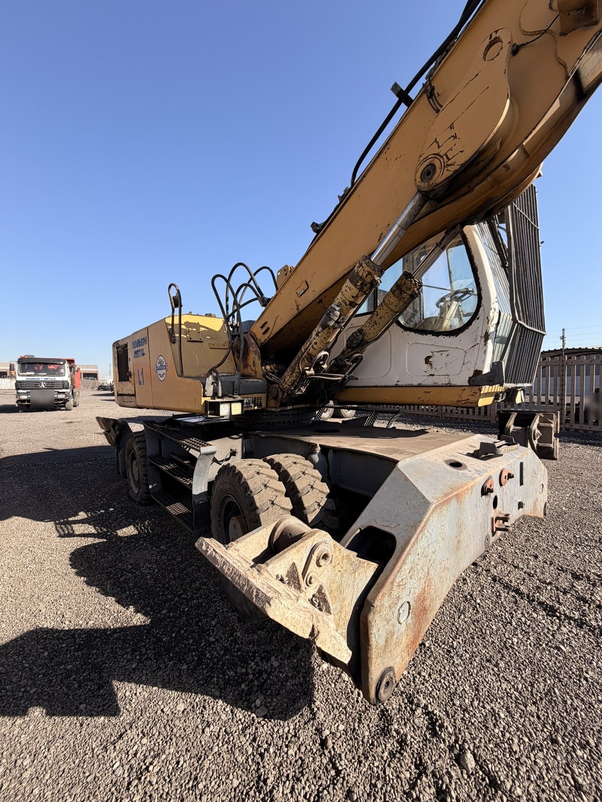 Used Liebherr 924 material handler, front three-quarter view with the boom out
