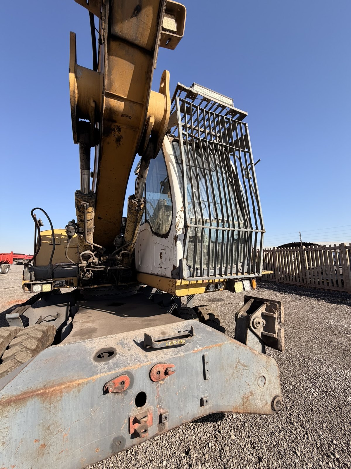 Used Liebherr 924 material handler, front view of the cab and grille guard