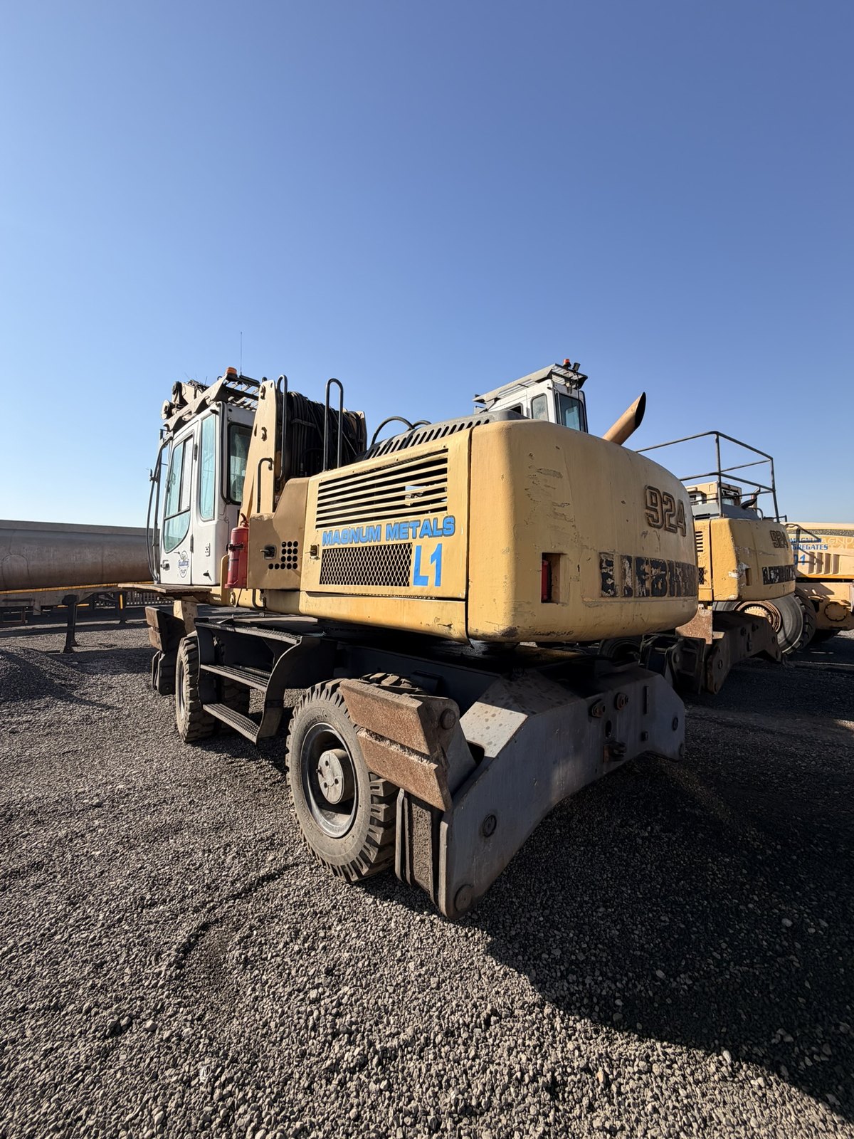 Two Liebherr 924 material handlers standing side by side in the consignment yard