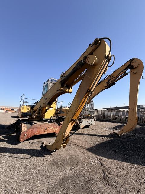 Used Liebherr 924 material handler, side profile with the boom and stick lowered