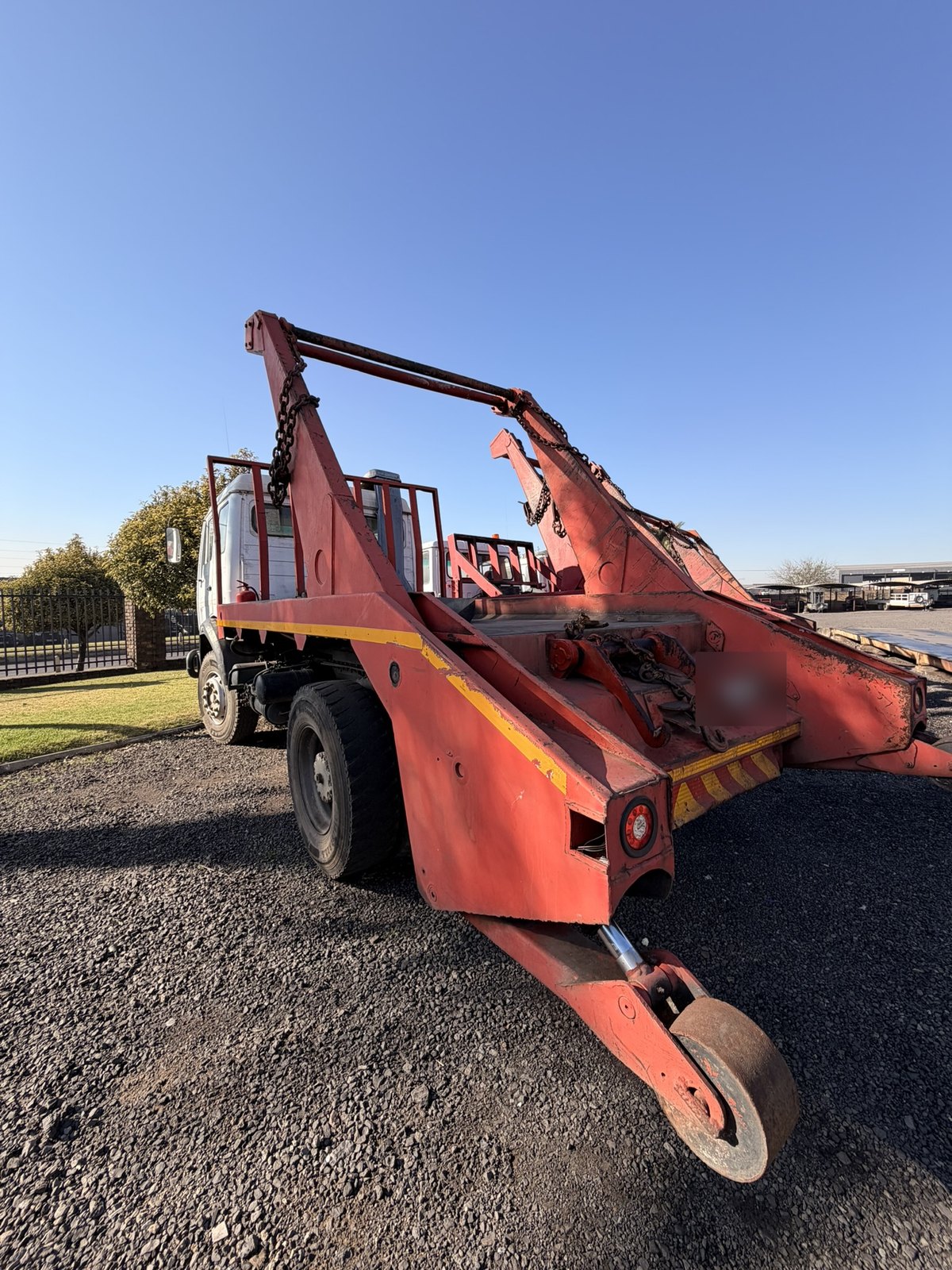 Used Mercedes skip loader truck, rear three-quarter view of the skip-loading gear