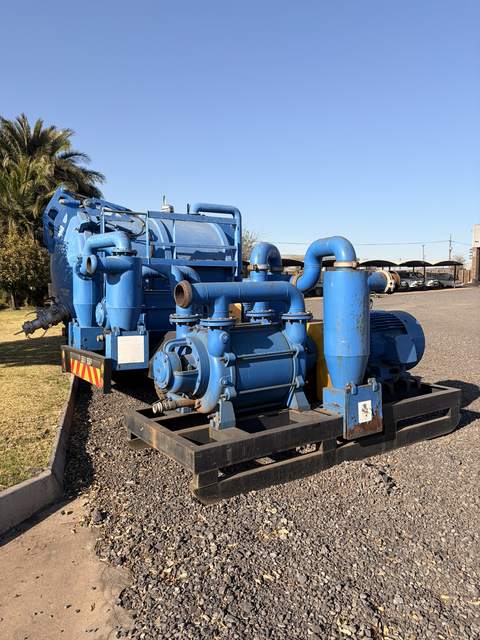 Used skid-mounted slurry pump, side view of the pump and frame