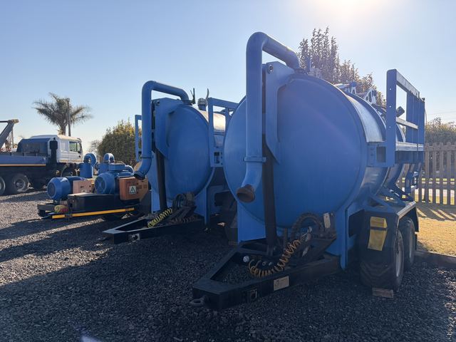 Used vacuum tanker trailer, front three-quarter view of the tank and drawbar