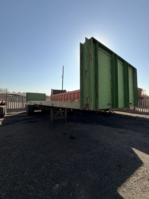 Used 12m trailer with high steel sides, full length with the high steel sides standing at the rear