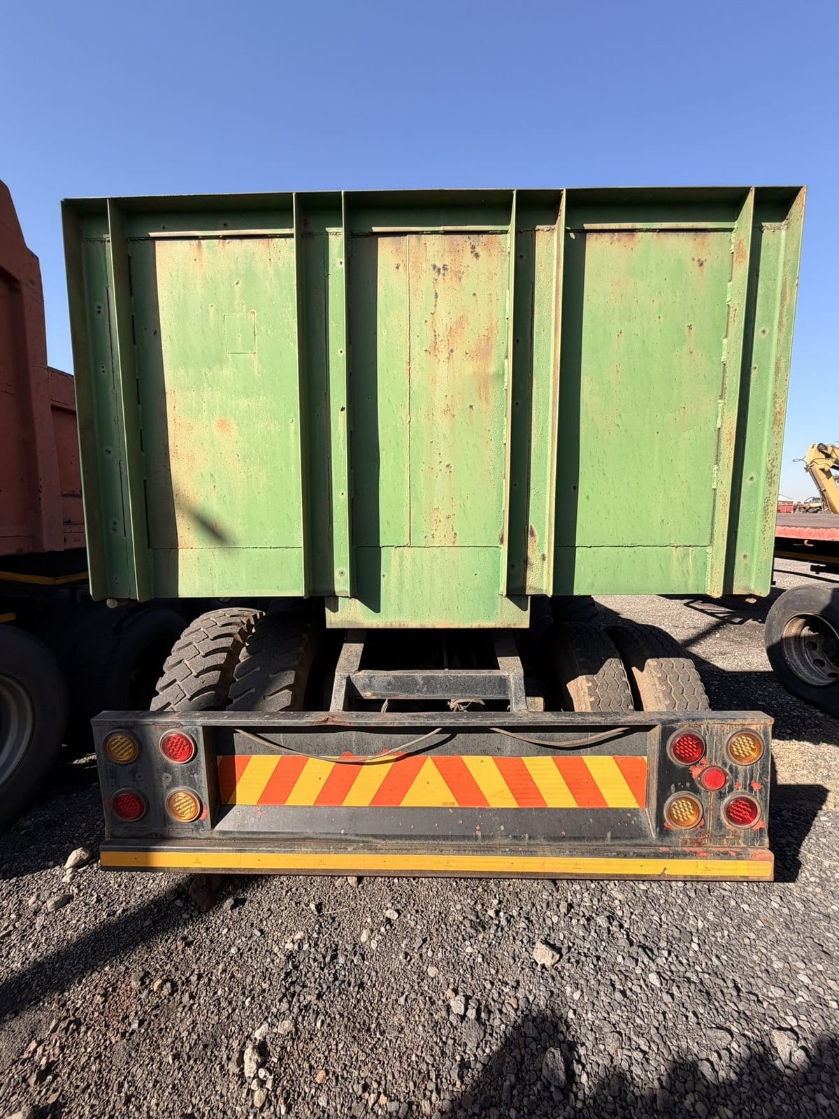 Used 12m trailer with high steel sides, head-on rear view of the high steel sides and tail lights