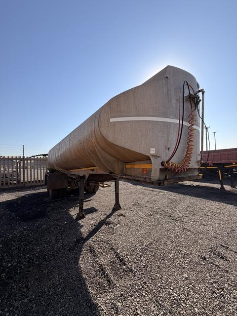 Used water tanker, nearside three-quarter view of the tank barrel standing on its landing legs