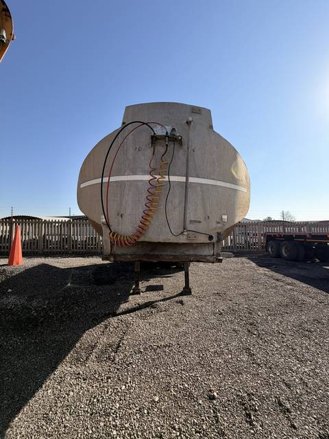 Used water tanker, front-on view of the tank barrel and headboard