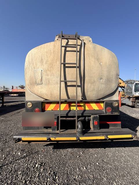 Used water tanker, rear view of the tank, ladder and rear bumper